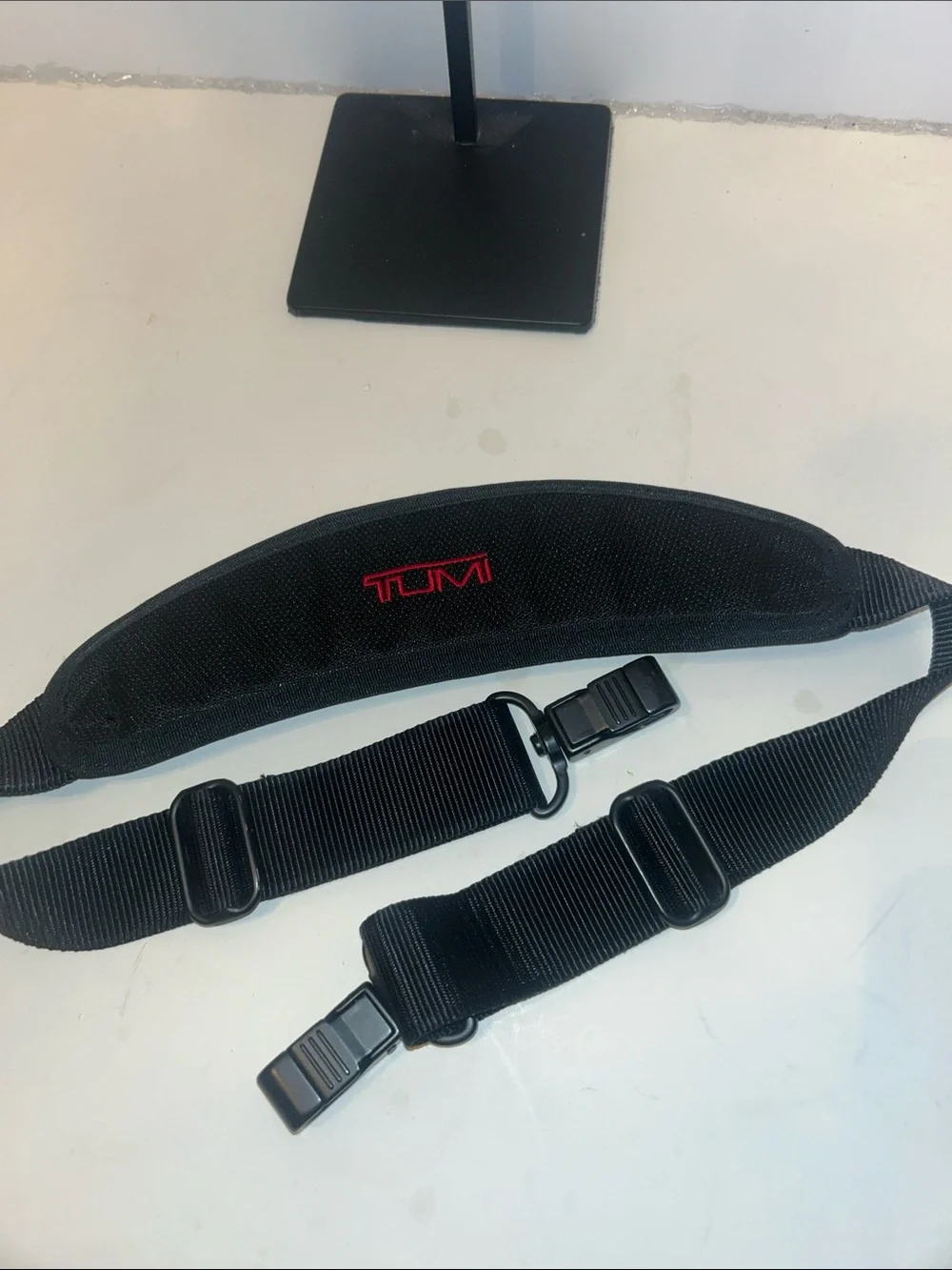 Tumi Black Duffel Bag with Red Logo Accent